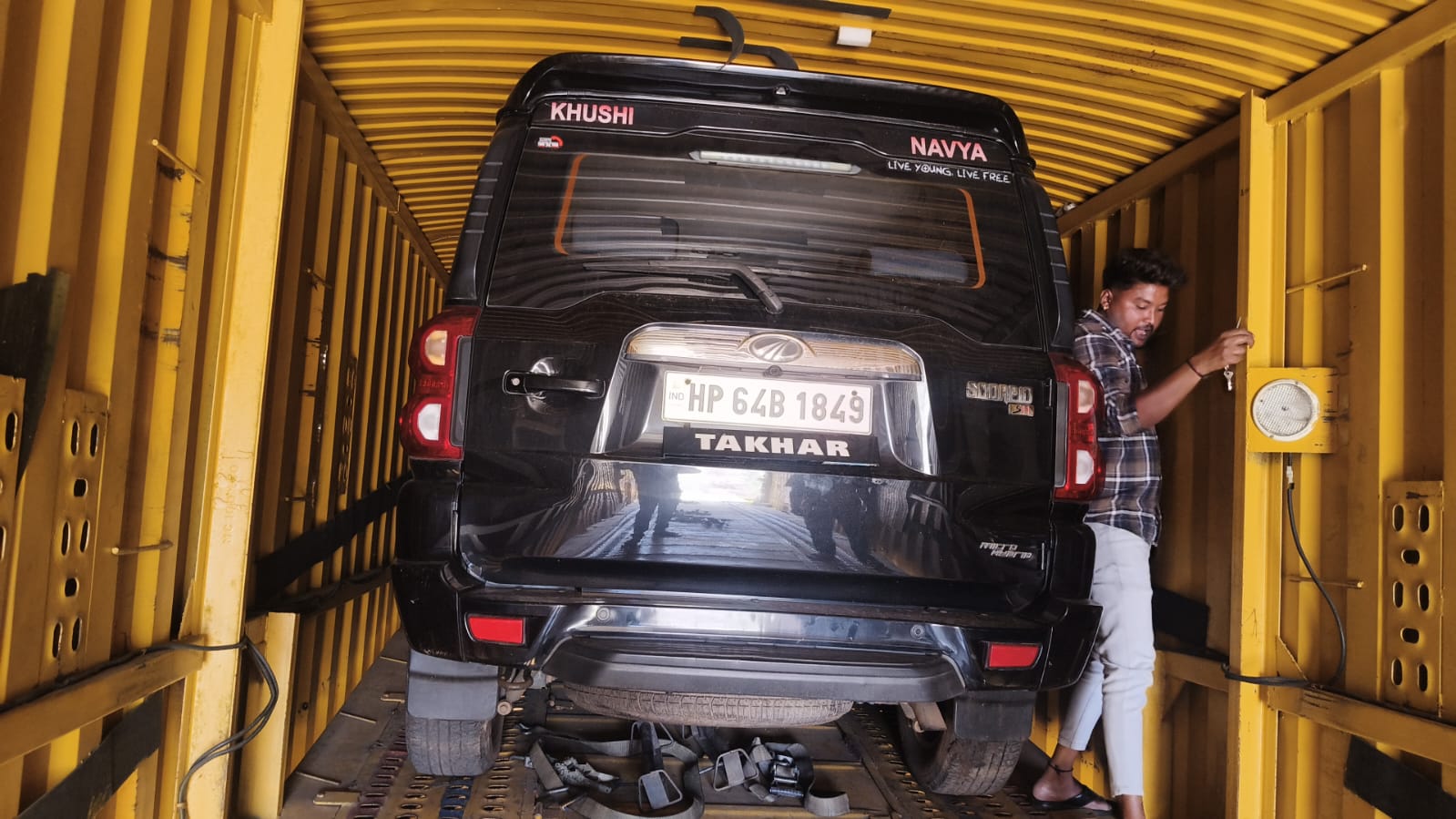 SUV secured inside transport container