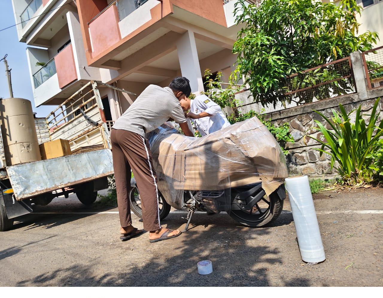 Shekhawat Packers and Movers Hubli - bike loading onto transport truck