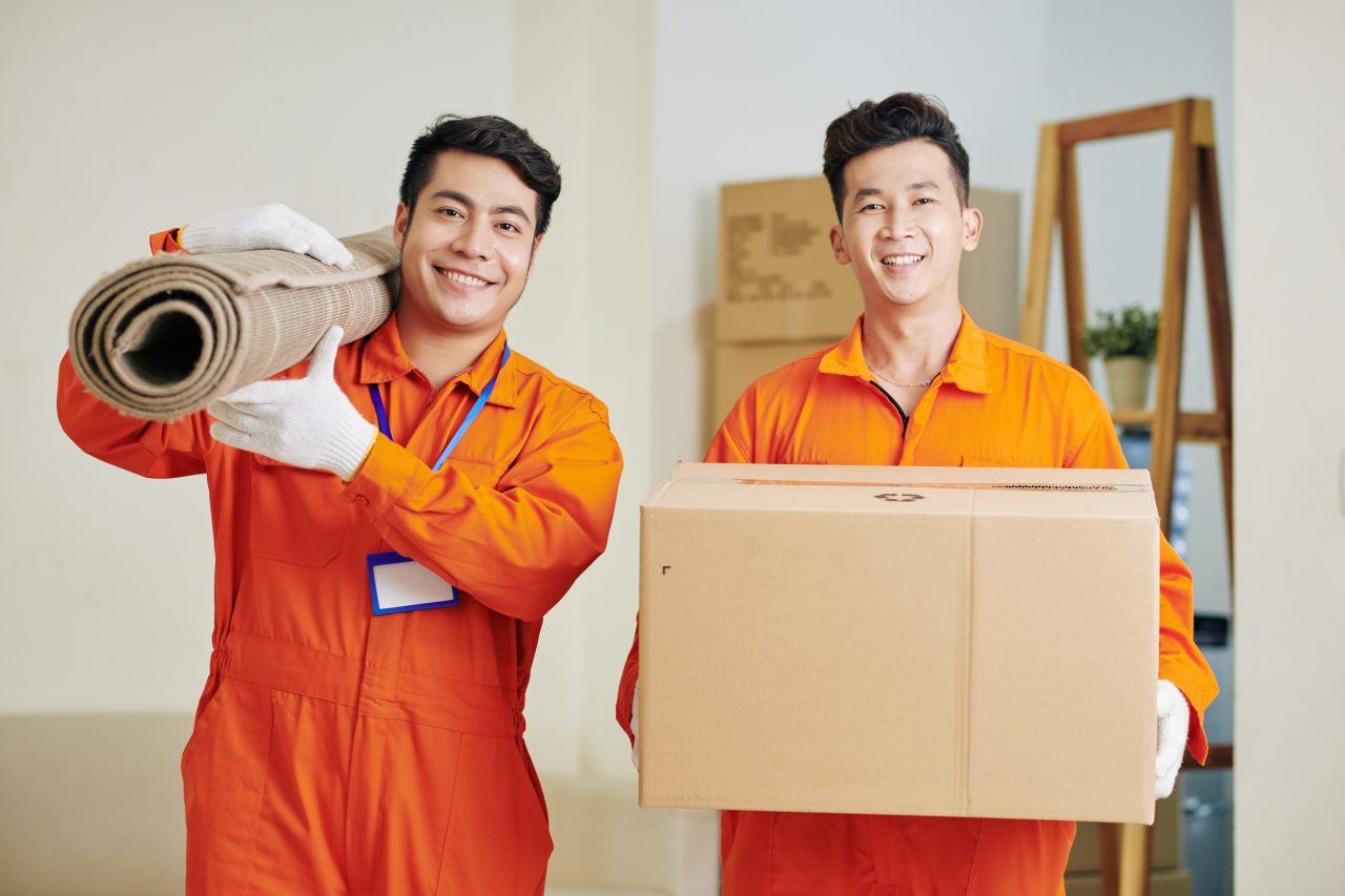 movers carrying carpet and cardboard box e1696398940352 1